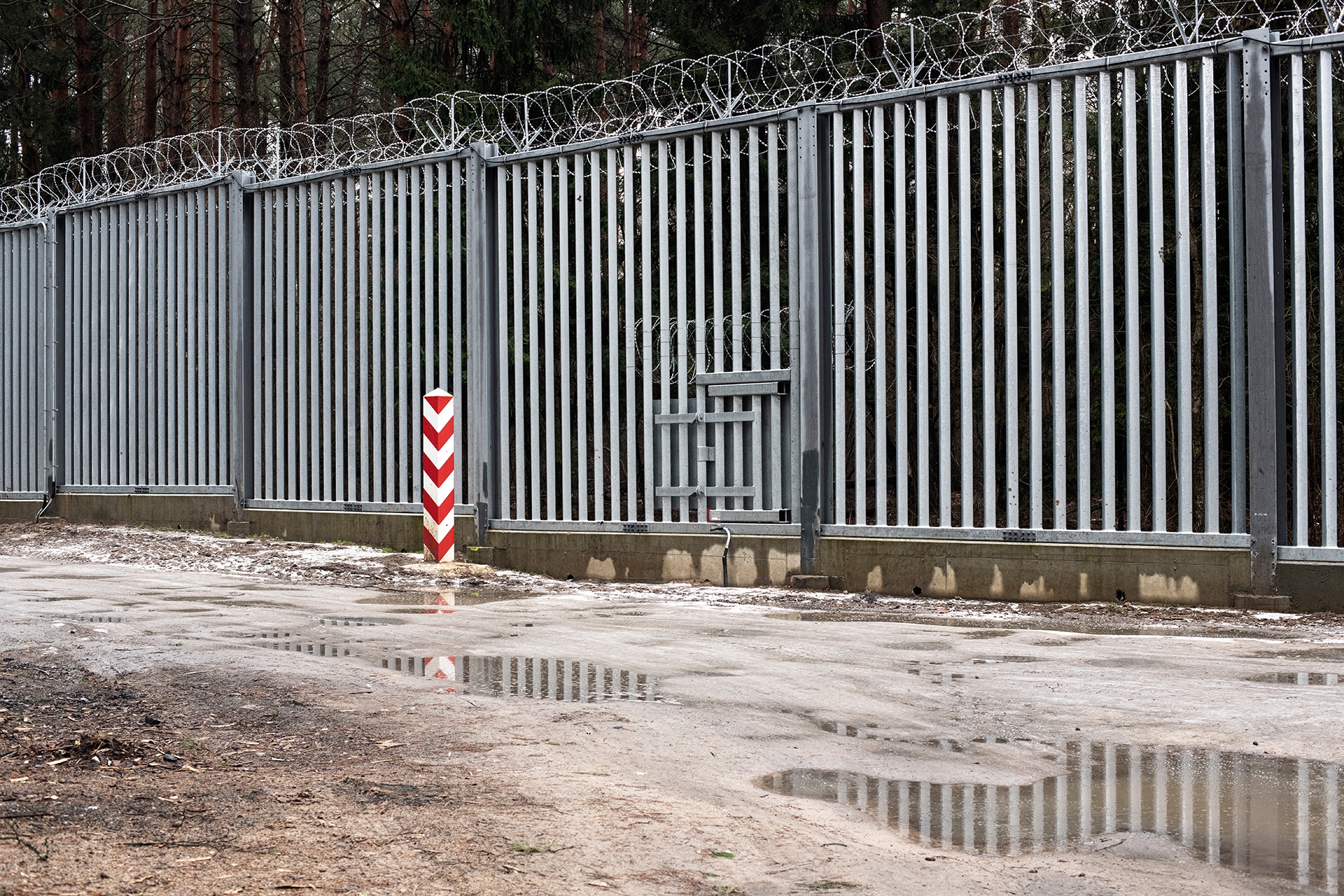   Photo above: The anti-migration wall at the Polish-...