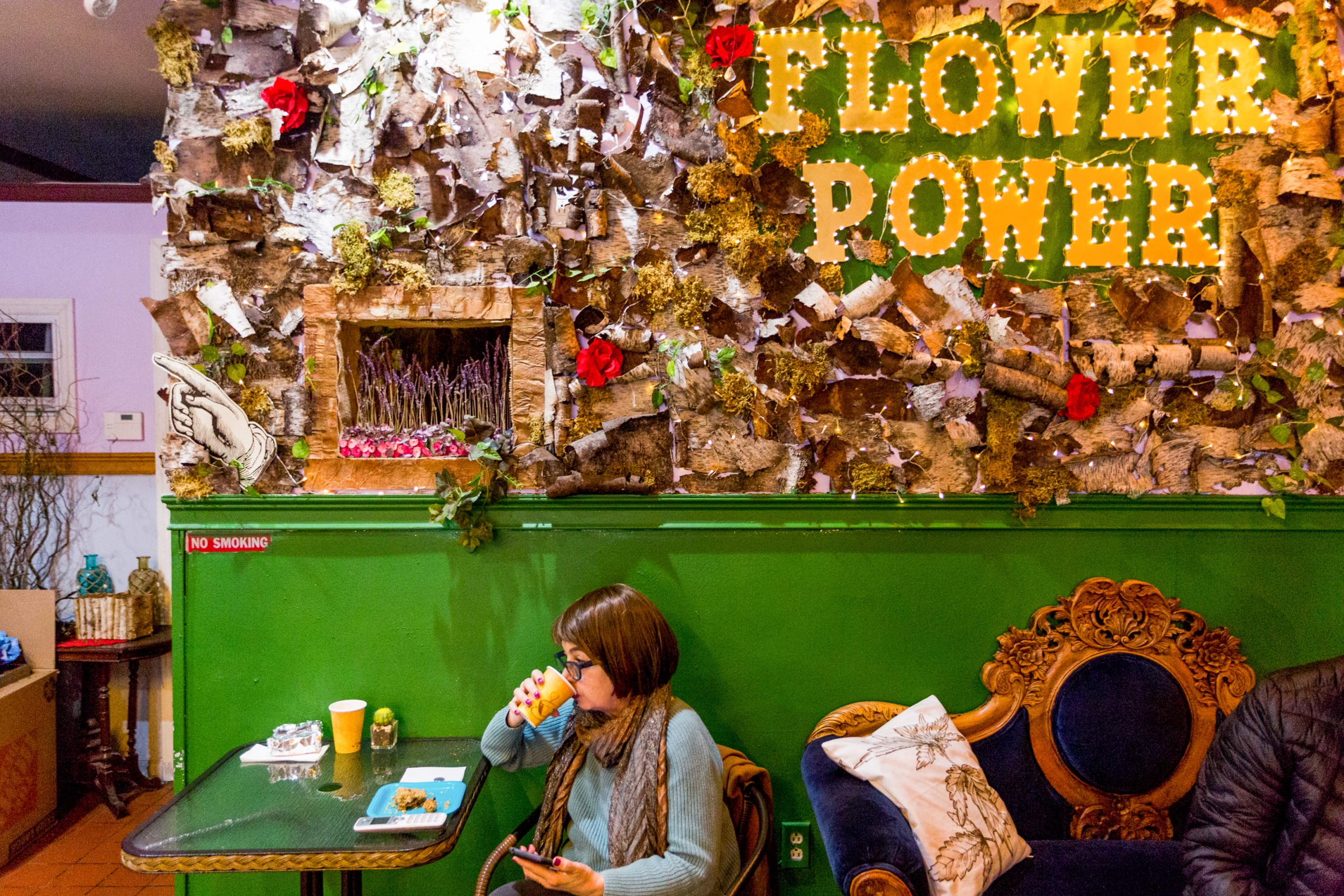 Gail Grabowski drinks a coffee at the Flower Power Coffee...