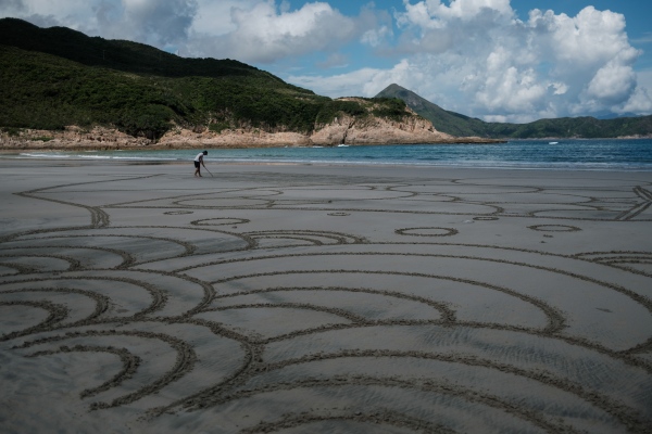 Hong Kong sand artist turns beaches into giant canvases...