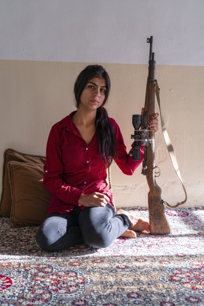  Halema is 20 years old. The weapon she is holding...